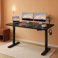 Electric height adjustable standing desk featuring a spacious 55 inch desktop and sturdy steel legs.