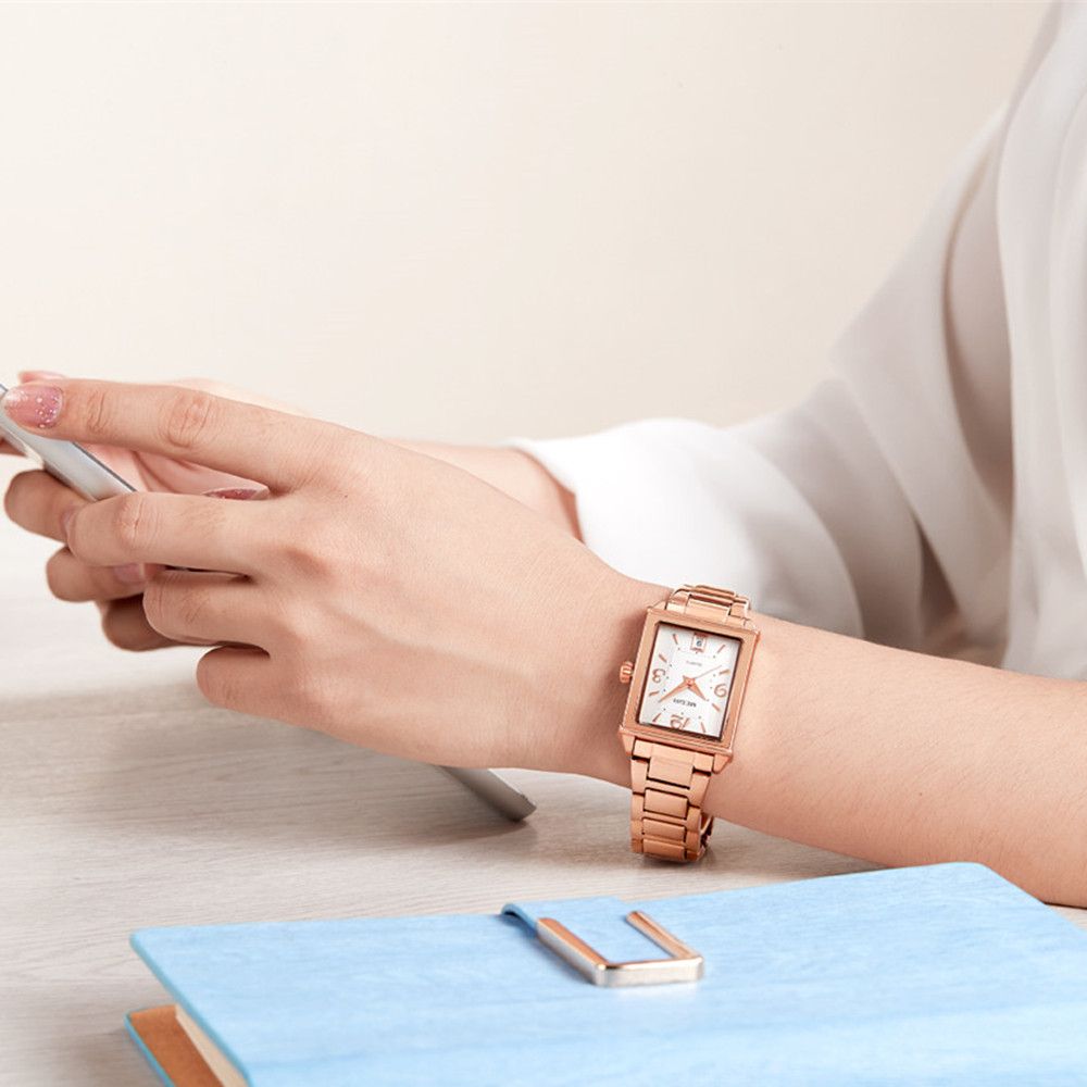 Elegant women's quartz wristwatch with polished steel band, zinc alloy case, and classic analog dial — view 2