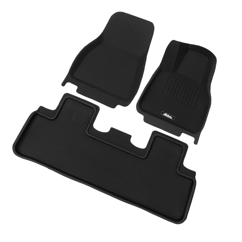 Custom moulded black rubber front and rear floor mats for Tesla Model Y interior protection. — view 3