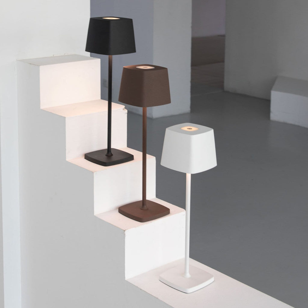 Minimalist aluminum alloy rechargeable LED desk lamp featuring a sleek cordless design for modern living spaces