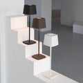 Minimalist aluminum alloy rechargeable LED desk lamp featuring a sleek cordless design for modern living spaces