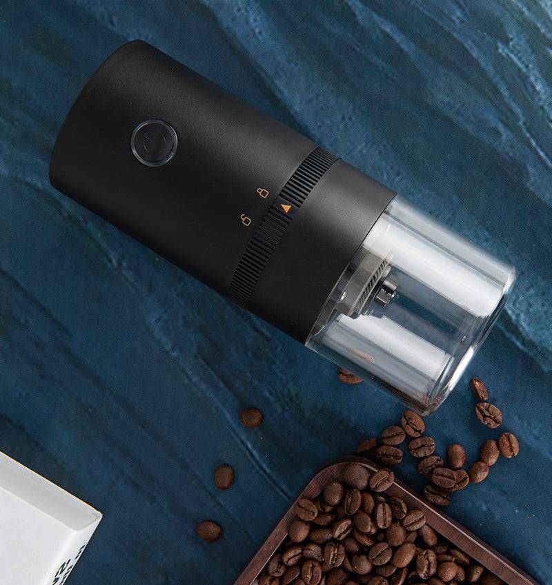 Portable electric coffee grinder with ceramic burr mechanism transparent chamber and sleek modern travel design — view 3