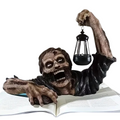 Realistic crawling zombie garden statue holding an LED lantern, made of hand-painted resin.