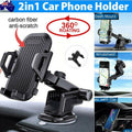 Universal car phone holder with carbon fiber finish, mounted securely on a vehicle dashboard.