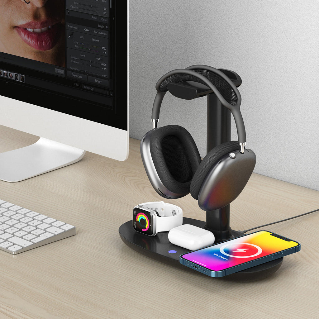 Black minimalist 15W wireless charging headphone stand with smart devices on a modern desk setup — view 5