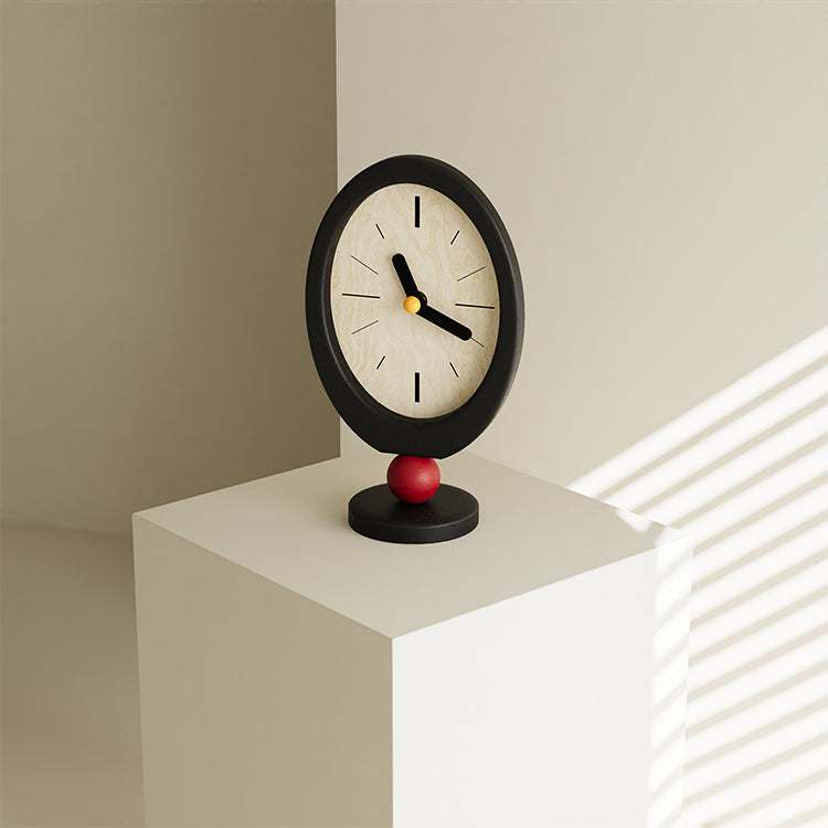 Minimalist retro desktop clock in oval wood with a playful red sphere base — view 5