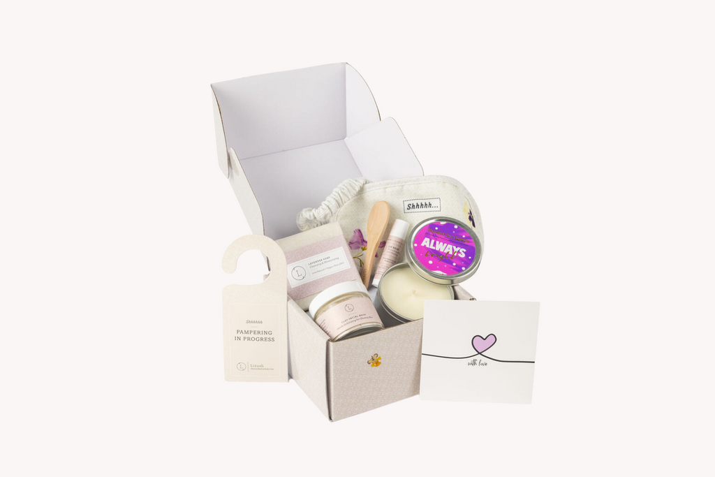 Natural lavender bath gift set with handmade soap, clay mask, soy candle, and cotton eye mask