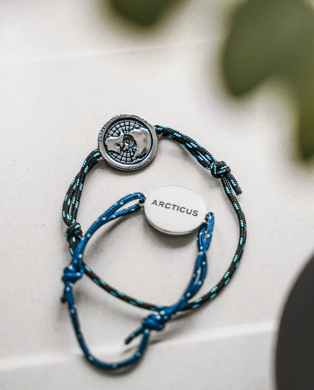 Arctic Circle black rope bracelet with stainless steel map charm and blue lines detail — view 3