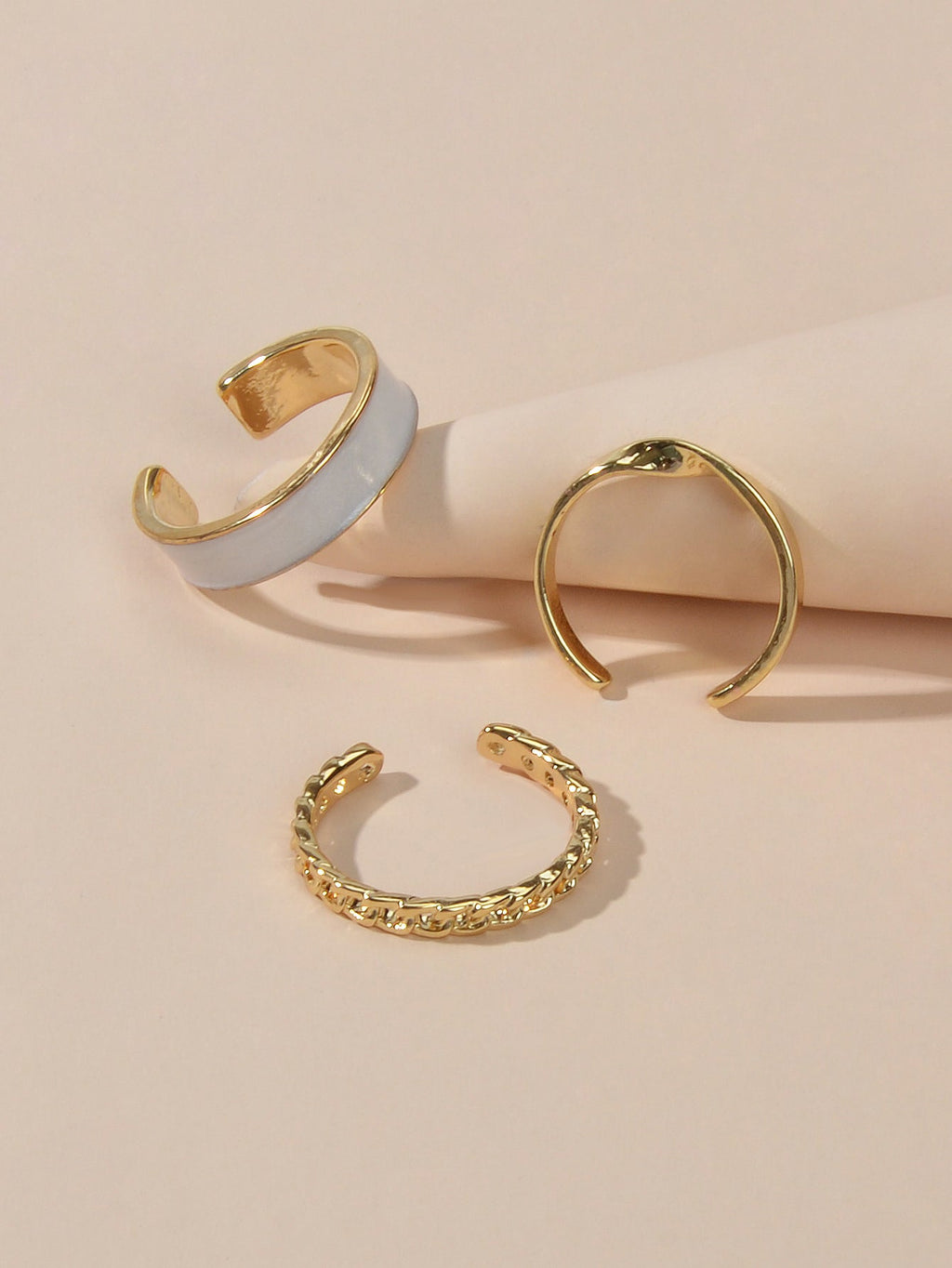 Three piece retro stackable white enamel midi knuckle ring set displayed together — view 4