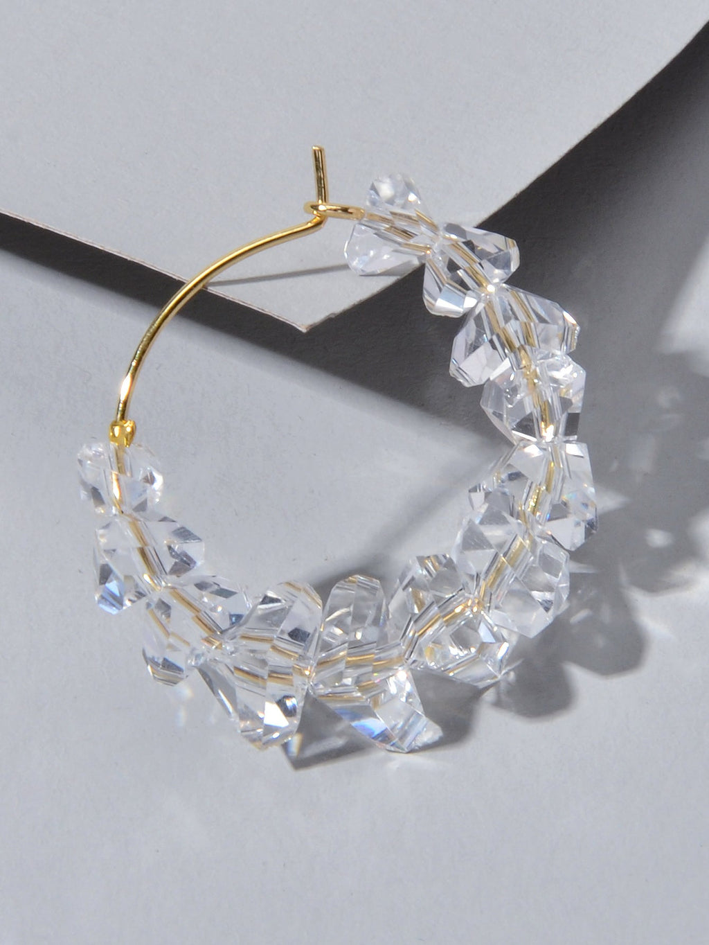 Transparent acrylic bead hoop dangle earrings for women on a clean background. — view 4