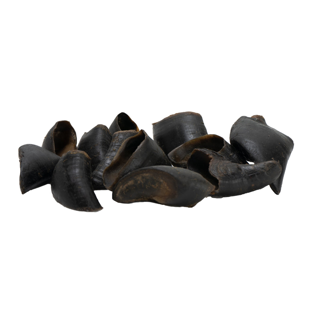 Four natural dark brown water buffalo hooves dog chews arranged together in a clear package — view 5