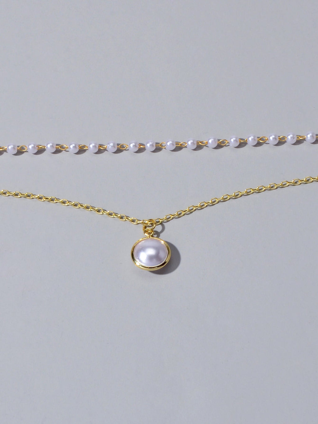 Retro gold double layer chain necklace featuring a classic lustrous pearl pendant for women — view 4