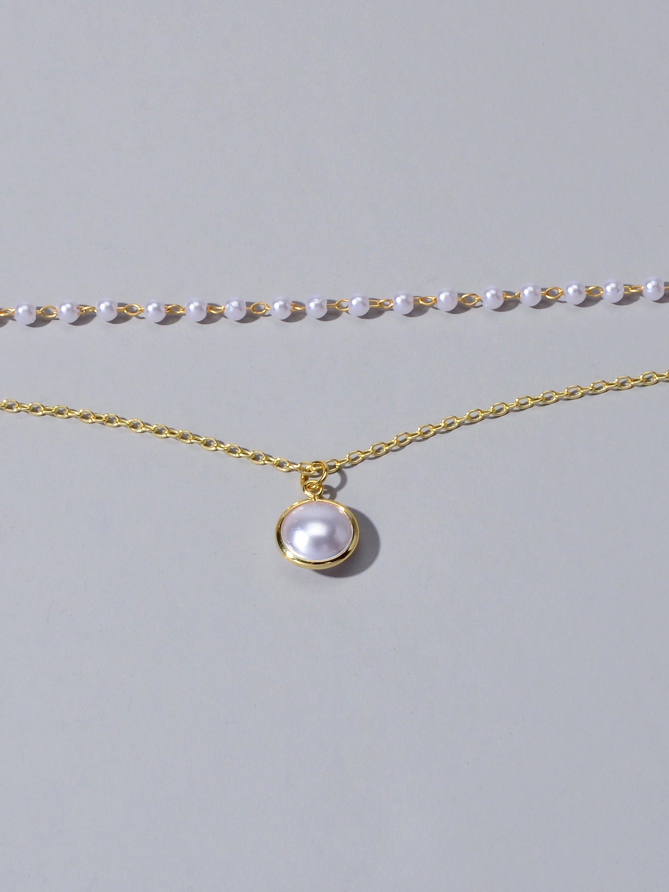 Retro gold double layer chain necklace featuring a classic lustrous pearl pendant for women — view 4