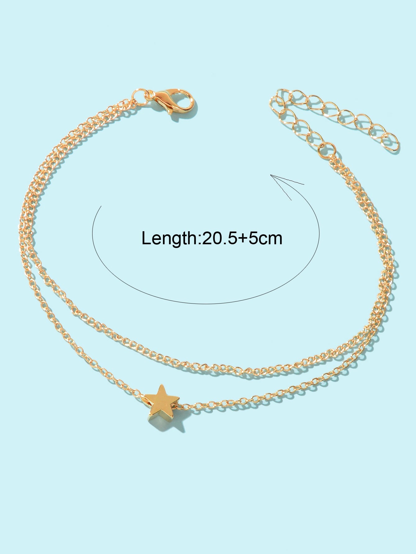 Minimalist double layered gold chain anklet featuring delicate star charms on a plain background — view 4
