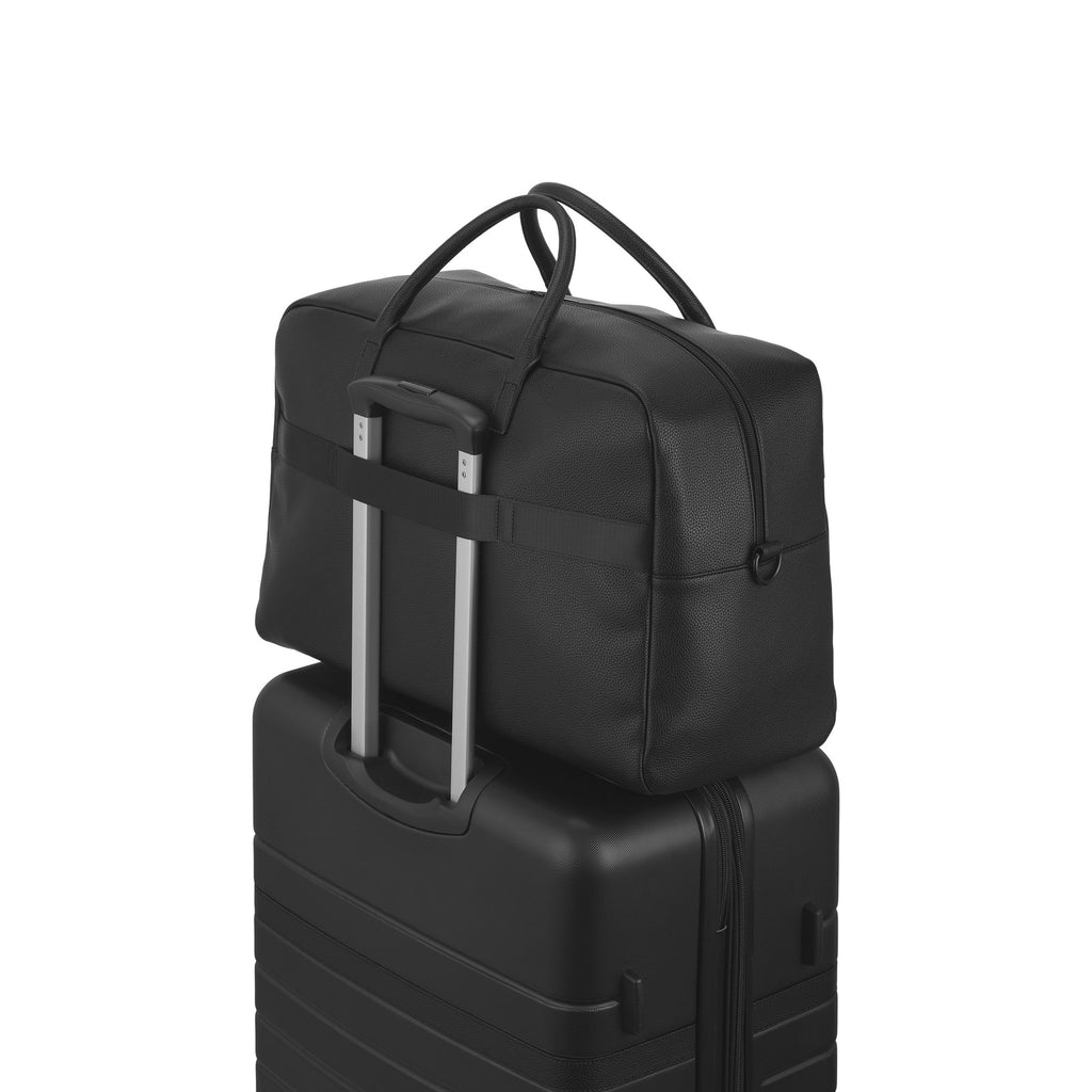 Premium Lisbon duffle bag, an elegant travel luggage with sturdy carrying handles and sleek structural design — view 4