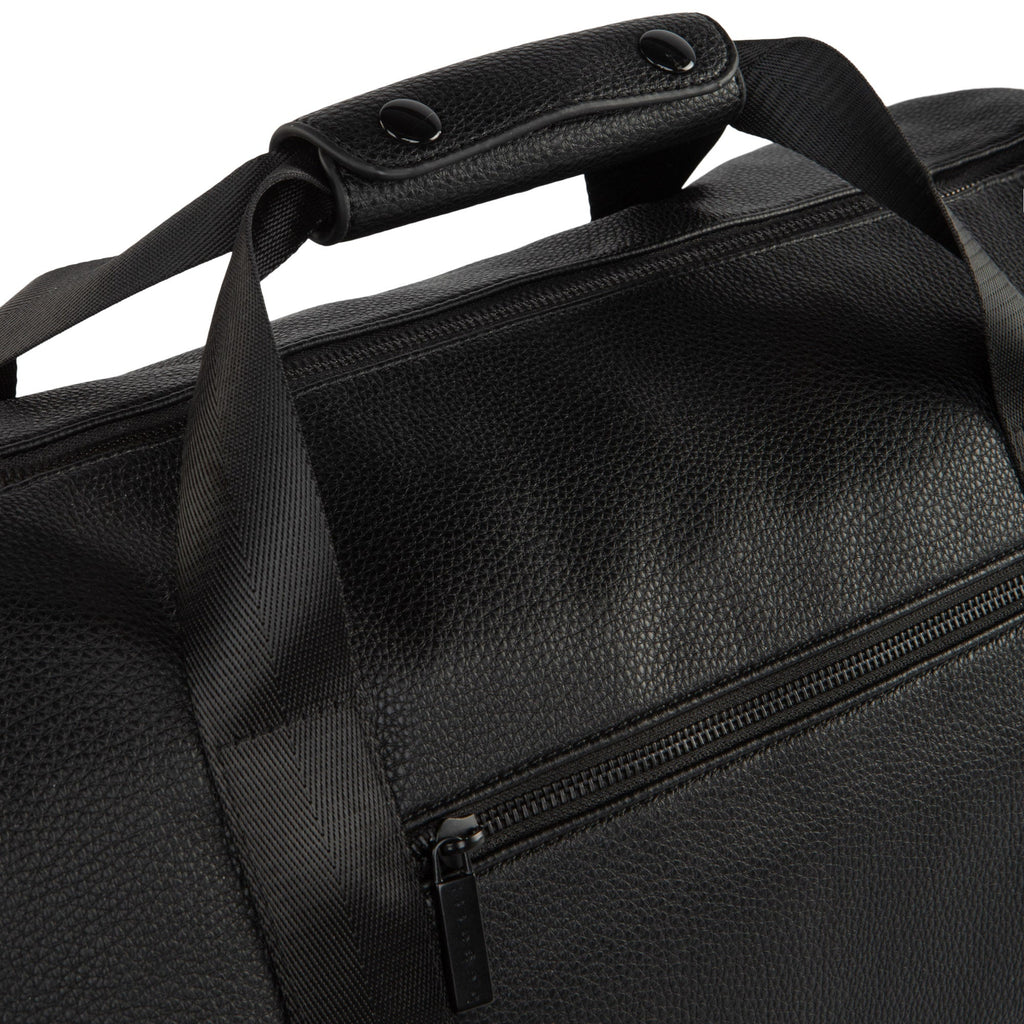 Textured vegan leather duffle bag with sturdy carrying handles and adjustable shoulder strap for travel — view 5