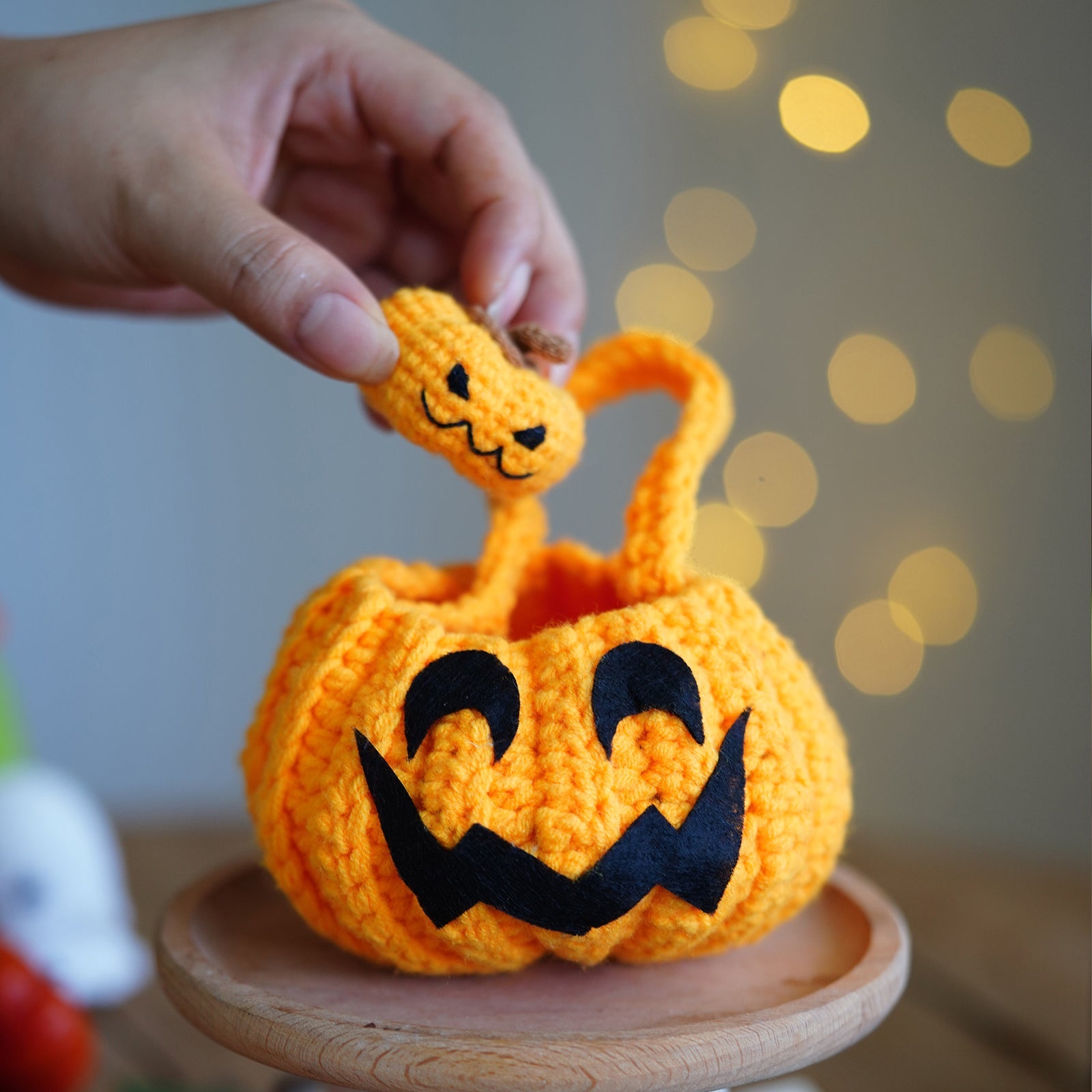 Halloween amigurumi crochet kit featuring a finished yarn pumpkin and cute little ghost plush figures — view 2