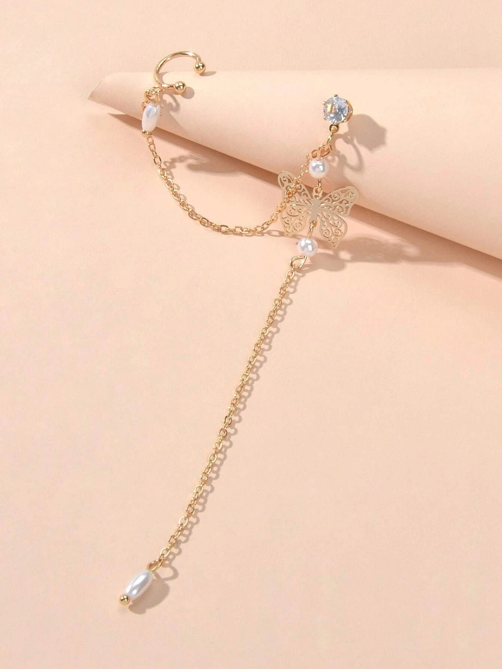 Crystal and pearl butterfly ear cuff with a long dangling chain and cartilage stud — view 4
