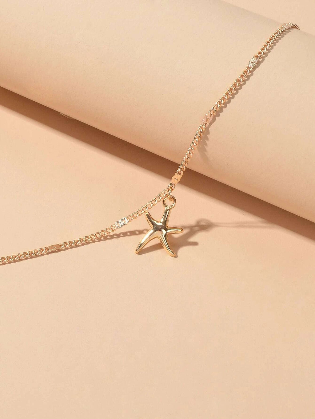 Silver and gold tone starfish charm boho anklet on a delicate adjustable foot chain — view 4