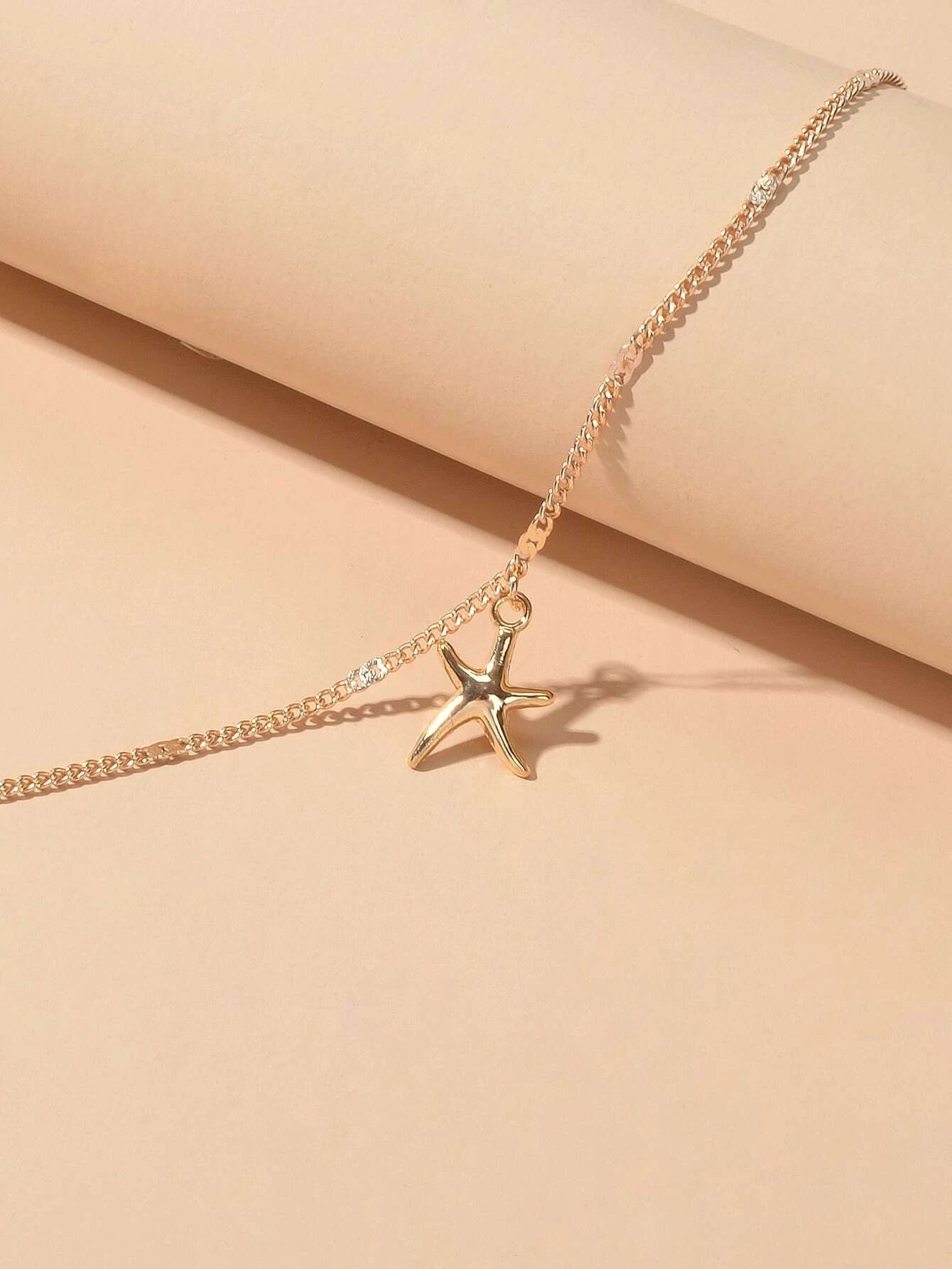 Silver and gold tone starfish charm boho anklet on a delicate adjustable foot chain — view 4