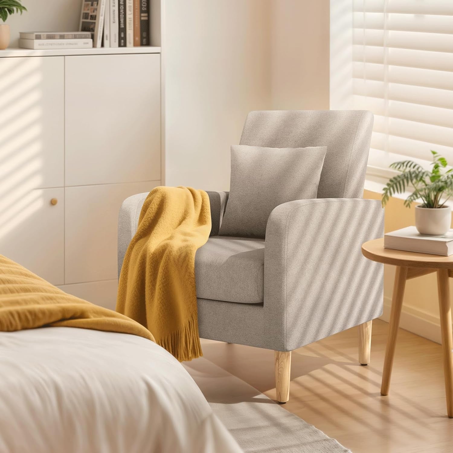 Beige upholstered contemporary accent chair with rubberwood legs and a cushioned lumbar support pillow. — view 3