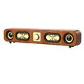 Wireless dual bass Bluetooth speaker featuring a sleek wood grain finish and modern portable design