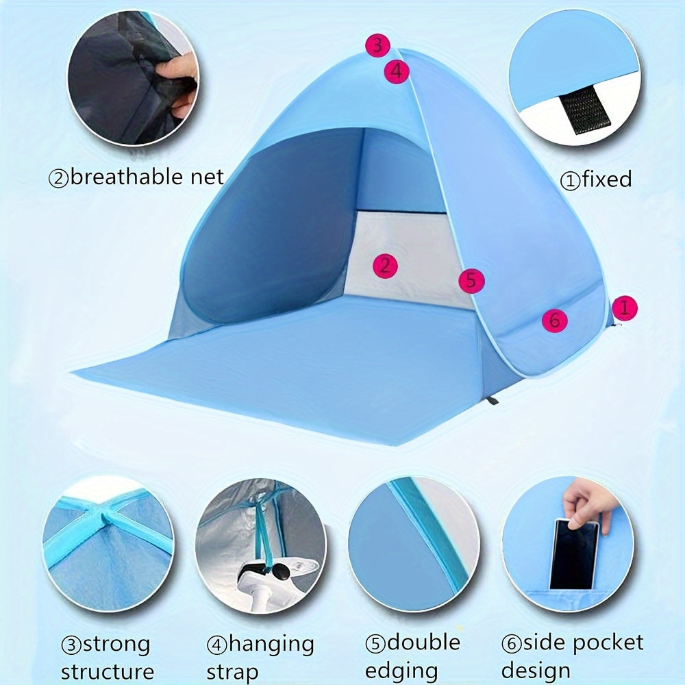 Portable waterproof beach tent in blue with sunshade pitched outdoors on sand — view 2