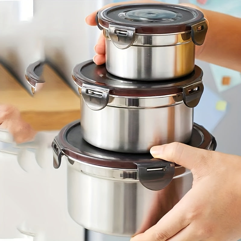 Three round stainless steel food storage containers with black leakproof clip-on lids — view 2
