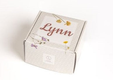 Organic new baby gift set in box with natural diaper balm, baby powder, and bib — view 2