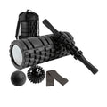 Black 6-in-1 yoga training set with foam roller, massage stick, tension band, and massage balls