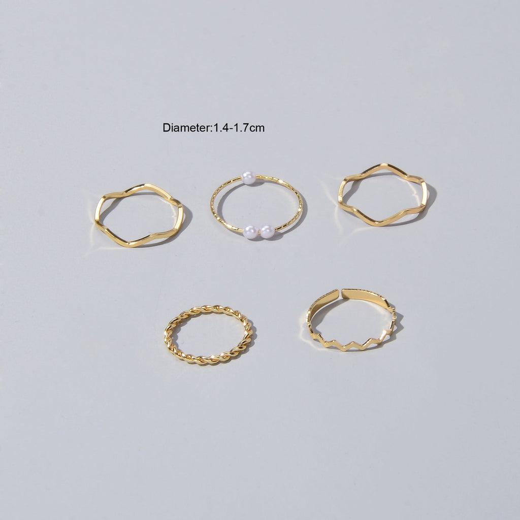 5 piece stackable minimalist finger ring set in metal with elegant pearl accents — view 4