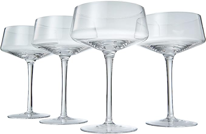 Four luxury glass martini coupes with an elegant silver mixing spoon for cocktail entertaining — view 5