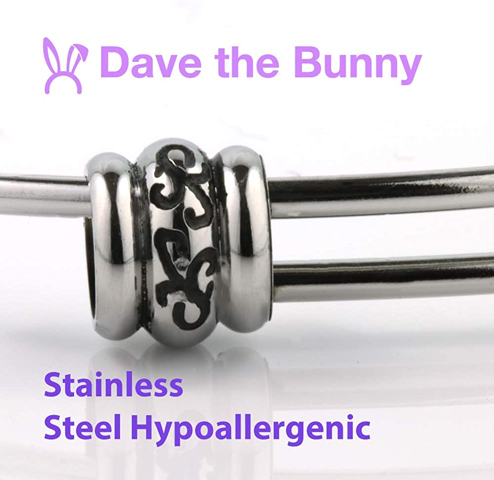 Stainless steel Saint Benedict medal snake chain charm bracelet on a neutral background — view 3