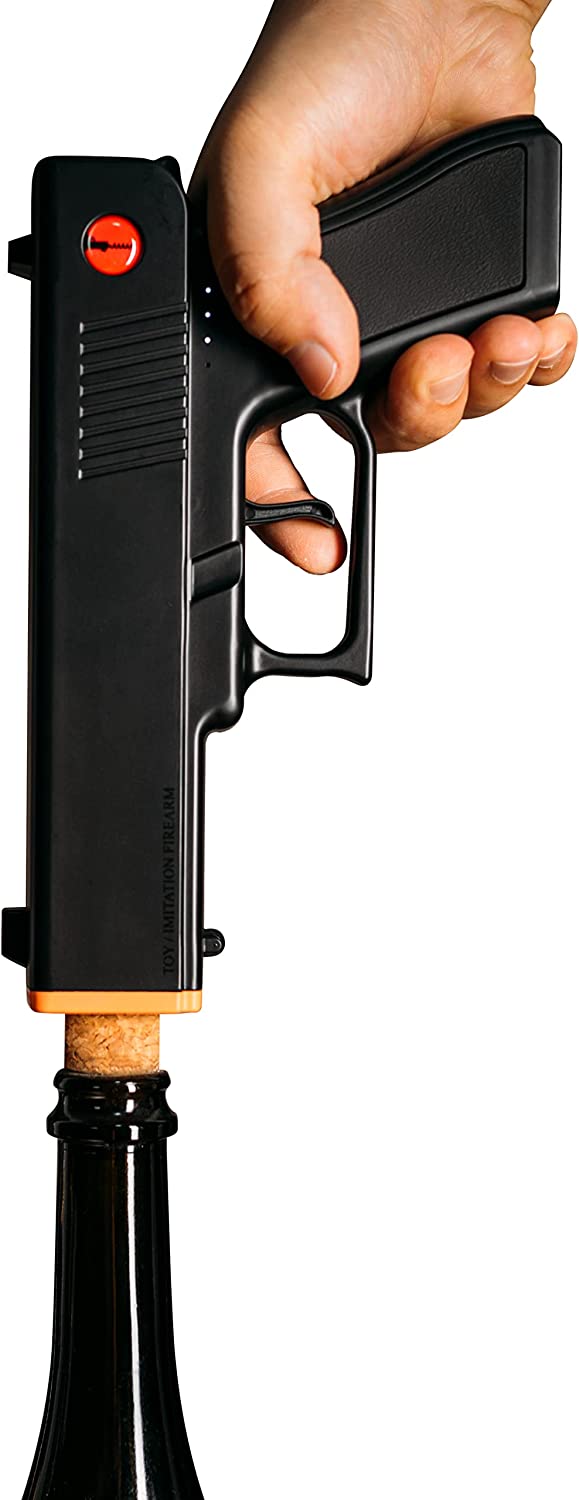 Black electric pistol shaped wine bottle opener resting in its rechargeable holster base. — view 5