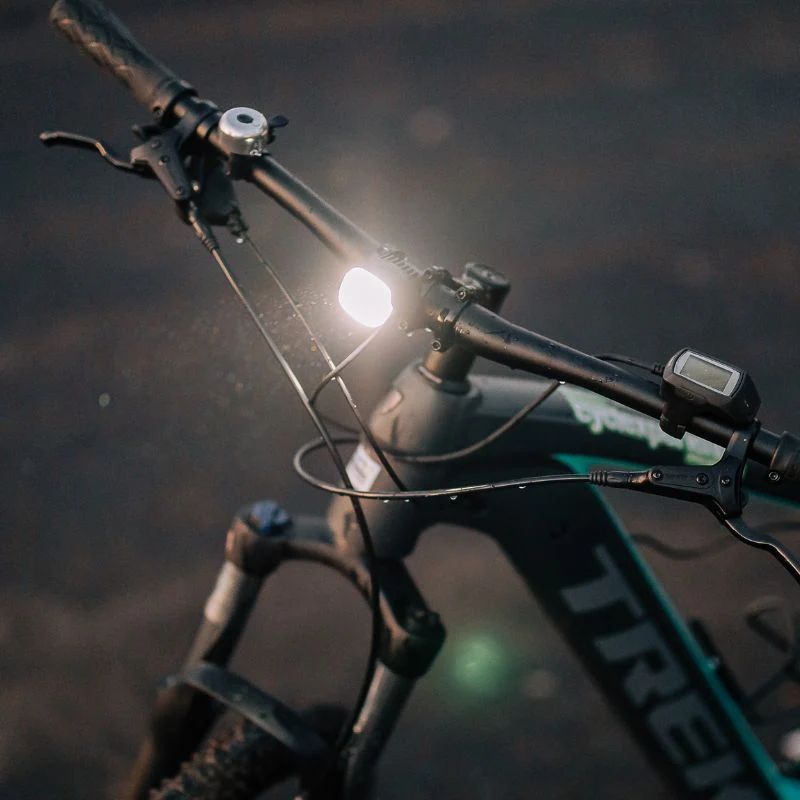 Black aluminum Magicshine ME 100LUX e-bike headlight with adjustable handlebar mounting bracket — view 4