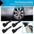 Four black metal and plastic tire pressure monitoring sensors for vehicle wheels