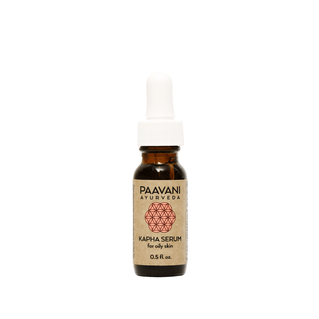 Amber glass bottle of Kapha Ayurvedic face oil serum for oily skin