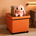 Orange faux leather storage ottoman with a solid wooden tray table top for living rooms