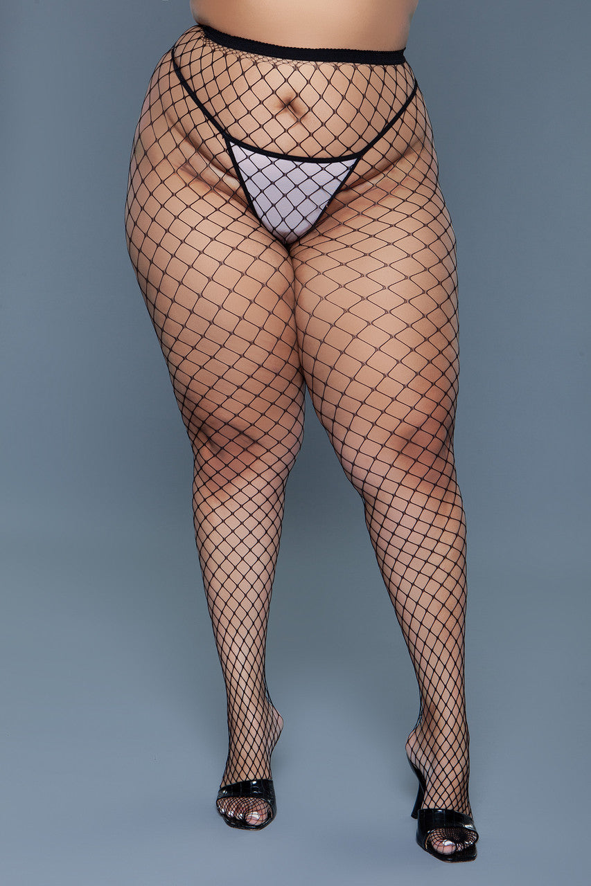 Oversized fishnet pantyhose with a solid waistband styled as bold black evening hosiery — view 4