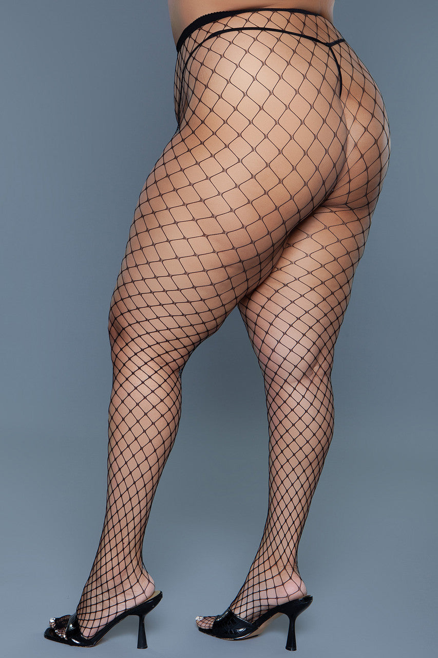 Oversized fishnet pantyhose with a solid waistband styled as bold black evening hosiery — view 5