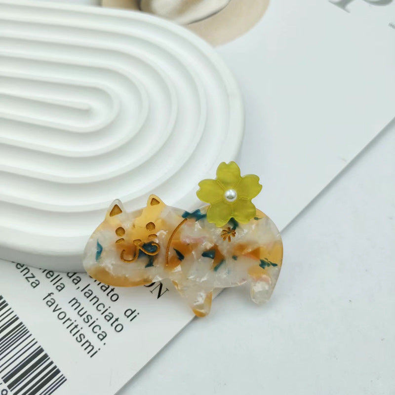 Hand-painted floral cat hair clip in eco-friendly cellulose acetate with glass rhinestones and alligator grip — view 2