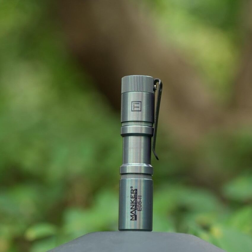 Manker E05II Ti EDC Flashlight in bead-blasted titanium with deep carry pocket clip — view 4