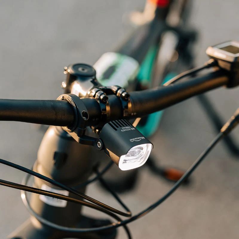 Black aluminum Magicshine ME 100LUX e-bike headlight with adjustable handlebar mounting bracket — view 3