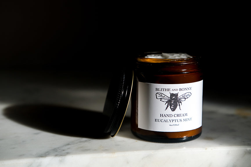 Luxurious vegan hand cream in a four ounce amber glass jar with a metal lid — view 5