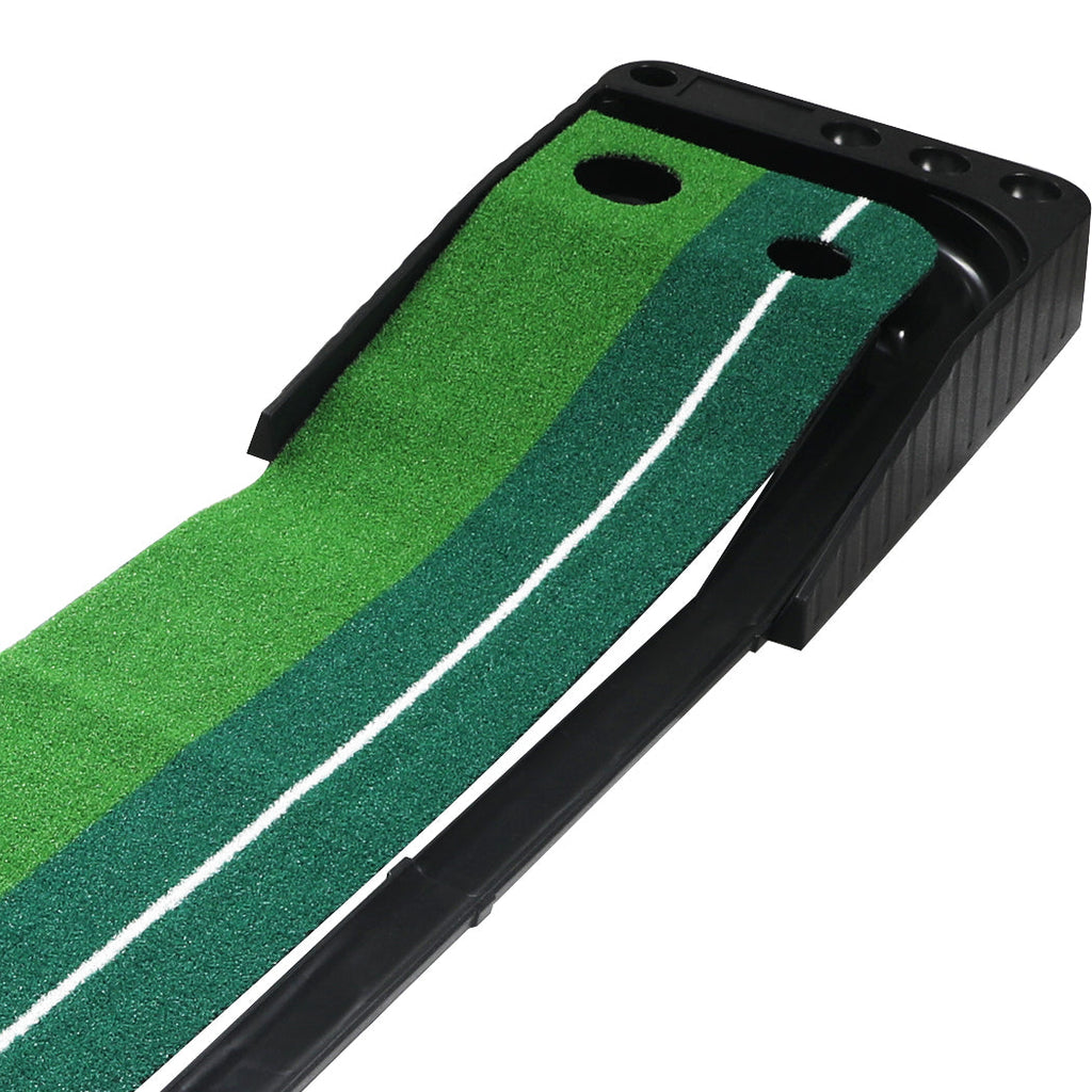 Portable green golf putting mat with ball return track, steel putter, and three white golf balls. — view 5