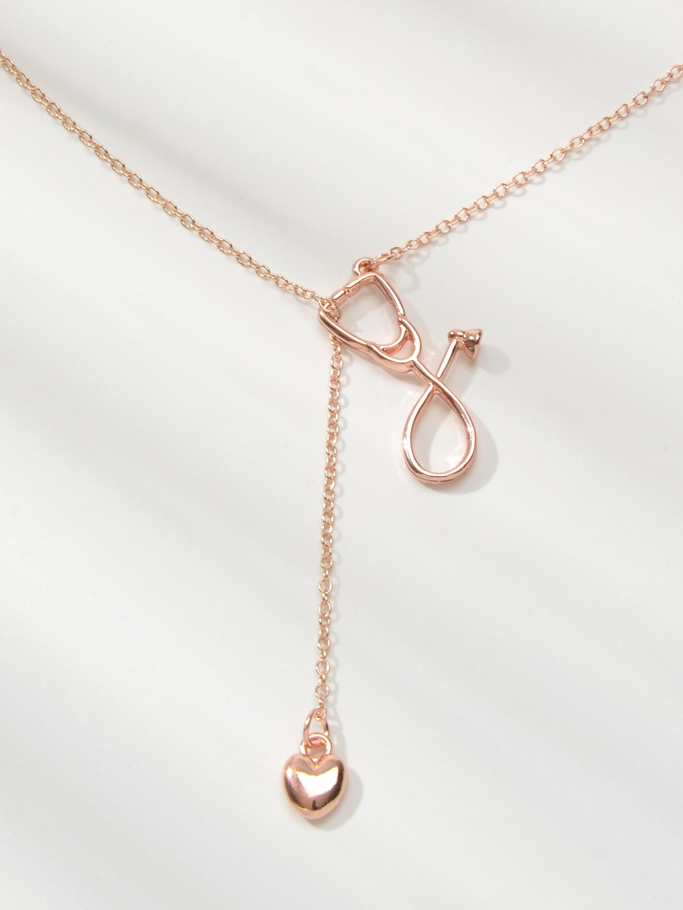 Minimalist gold and silver stethoscope heart pendant Y-shape necklace on a delicate chain — view 5