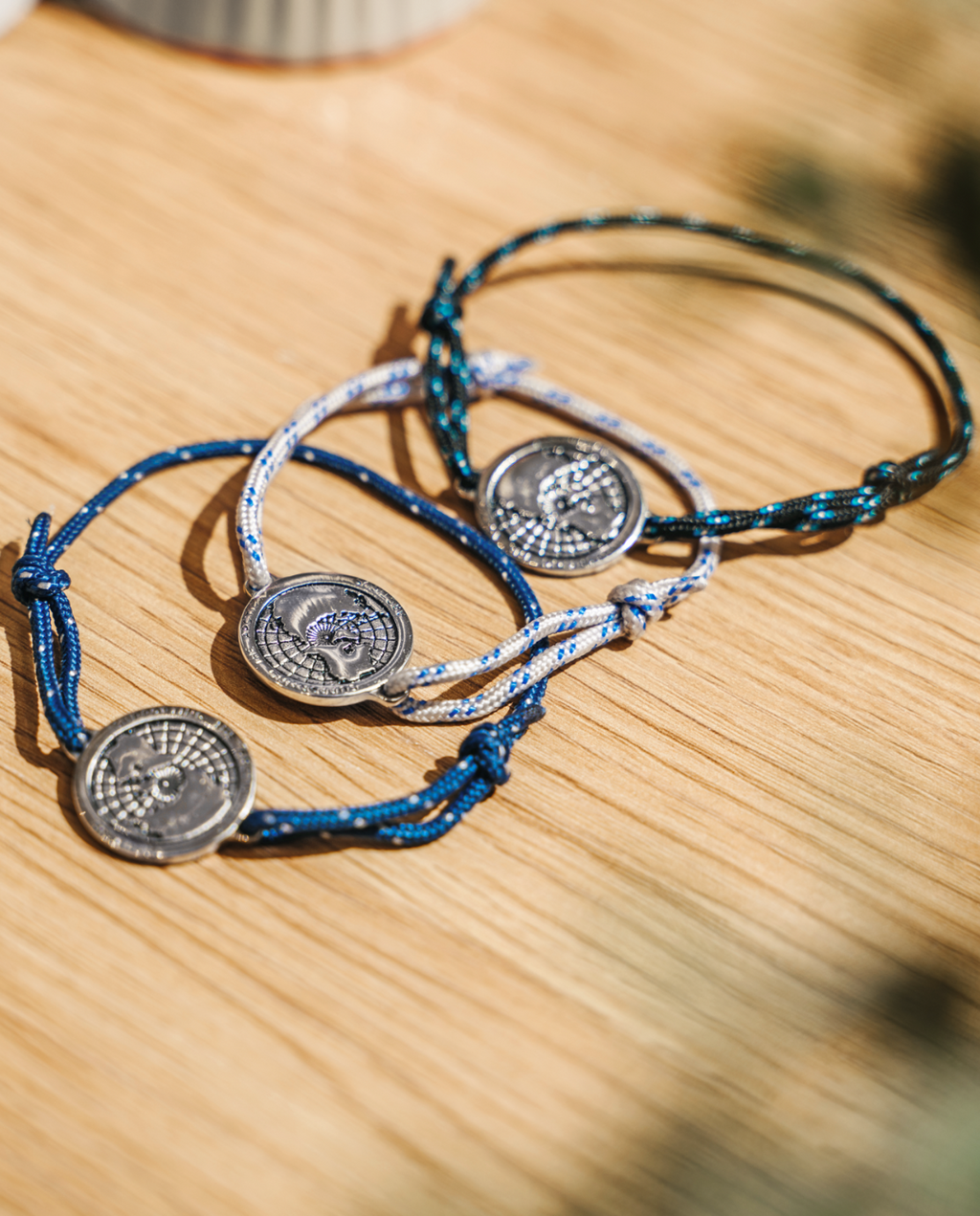 Arctic Circle black rope bracelet with stainless steel map charm and blue lines detail — view 4