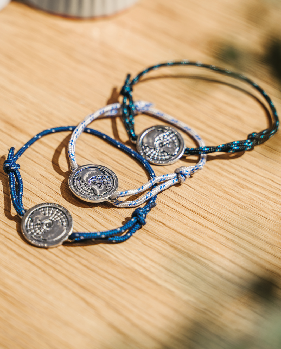 Arctic Circle black rope bracelet with stainless steel map charm and blue lines detail — view 4