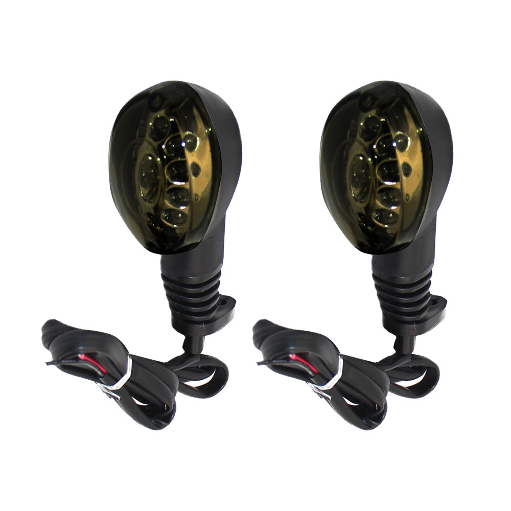 Smoke lens amber LED motorcycle turn signal indicator lights with connecting cables on white background