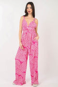 Women's printed pleated sleeveless wide leg jumpsuit in lightweight polyester with built-in side pockets